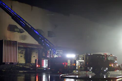 Firefighters work on cleanup after a fire ripped through a distribution center for the QVC home-shopping television network in Rocky Mount, N.C. on Saturday, Dec. 18, 2021. More than 300 employees were working at the facility when the fire was reported shortly after 2a.m. No injuries were immediately reported.