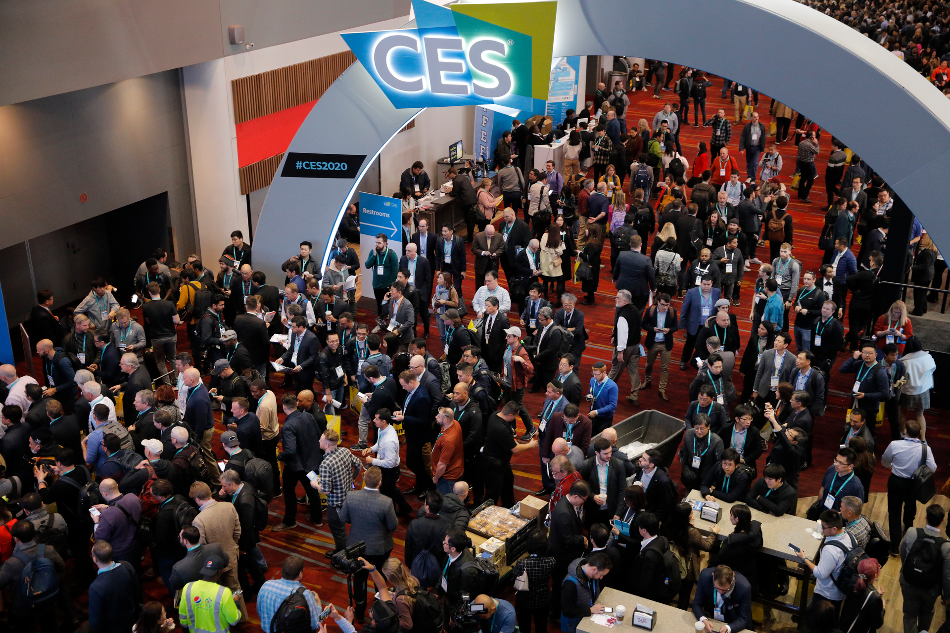Crowds enter the convention center on the first day of the CES tech show, Las Vegas, Jan. 7, 2020.