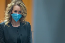 Elizabeth Holmes walks into federal court in San Jose, Calif., Jan. 3, 2022.