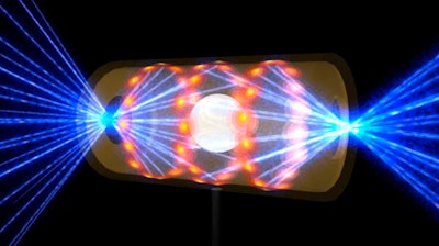 Illustration depicting a target pellet inside a hohlraum capsule with laser beams entering through openings on either end.