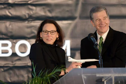 North Carolina Gov. Roy Cooper receives a model of Boom Supersonic's Overture jet from Boom President and Chief Business Officer Kathy Savitt, Greensboro, N.C., Jan. 26, 2022.