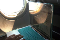 A passenger uses a laptop aboard a commercial airline flight from Boston to Atlanta on July 1, 2017. Concern about new high-speed wireless service interfering with airplanes appears to be easing. Federal safety regulators said Friday, Jan. 28, 2022 they have cleared the way for Verizon and AT&T to turn on more 5G towers.