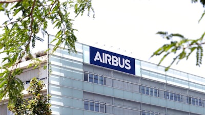 The logo of Airbus group is displayed in Toulouse, south of France, July 9, 2020. Airbus says aircraft deliveries are rising slightly and airlines are ordering more planes, showing that they are confident in the long-term outlook for air travel. For now, the pandemic is still hurting international air travel. Airbus, which is based in France, said Monday, Jan. 10, 2022 that it delivered 611 passenger jets in 2021, an 8% increase over 2020 deliveries.