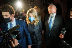 Elizabeth Holmes leaves federal court after the verdict in San Jose, Calif., Monday, Jan. 3, 2022. Holmes was convicted of fraud for turning her blood-testing startup Theranos into a sophisticated sham that duped billionaires and other unwitting investors into backing a seemingly revolutionary company whose medical technology never worked as promised.