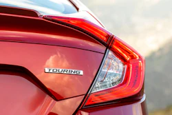 This undated photo provided by American Honda Motor Co. shows a trim name on a Honda Civic. In the trim lineup, Touring trims are typically more loaded with features than entry-level LX trims.