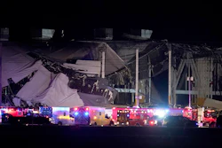An Amazon distribution center is heavily damaged after a strong thunderstorm moved through the area, Dec. 10, 2021, in Edwardsville, Ill. The family of a delivery driver who died last month when a tornado collapsed the central Illinois Amazon facility where he worked filed a wrongful death lawsuit Monday, Jan. 17, 2022 in Madison County.