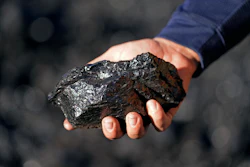 Sean Hovorka, production superintendent Trapper Mining, holds coal from the Trapper Mine on Thursday, Nov. 18, 2021, in Craig, Colo. Hovorka, also recently elected member of the town's city council, sees a future in mining because of renewables.