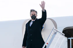 Secretary of State Antony Blinken waves as he departs the Geneva Airport, Friday, Jan. 21, 2022, in Geneva, Switzerland.