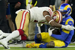 The San Francisco 49ers' Jimmie Ward, left, is called for a penalty as he hits the Los Angeles Rams' Odell Beckham Jr. during the NFC championship game, Inglewood, Calif., Jan. 30, 2022.
