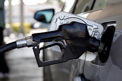 Fuel is pumped into a vehicle in Miami, June 14, 2012.