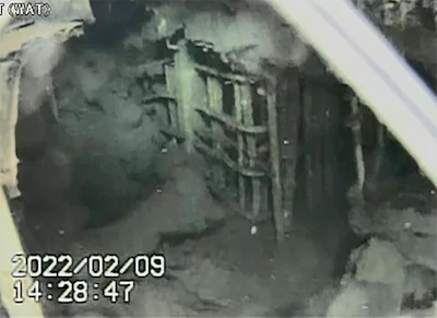 Images from a remote-controlled submersible robot show damaged areas inside the Fukushima nuclear power plant damaged in the 2011 earthquake and tsunami, Wednesday, Feb. 9, 2022, in Fukushima, Japan. The robot captured images of what appears be mounds of damaged fuel that had melted and fell to the bottom of the hardest-hit reactor at the nuclear plant for the first time since the 2011 disaster.