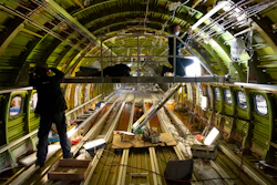 Engineers work on the conversion of a Boeing 767 passenger plane to a cargo plane at the Israel Aerospace Industries in Lod, Jan. 25, 2022.