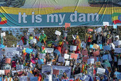 Ethiopians protest against international pressure on the government over the conflict in Tigray, below a banner referring to the Grand Ethiopian Renaissance Dam, Addis Ababa, May 30, 2021.