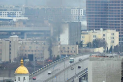 Smoke and flame rise near a military building after an apparent Russian strike in Kyiv, Ukraine, Feb. 24, 2022.