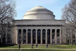 Students walk past the 'Great Dome' atop Building 10 on the Massachusetts Institute of Technology campus, April 3, 2017, in Cambridge, Mass.