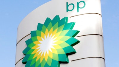 A view of the BP logo at a petrol station in London, Tuesday, Aug. 1, 2017. BP PLC reported its biggest full-year profit for eight years on Tuesday, Feb. 8, 2022 its coffers boosted by soaring oil and gas prices that have hiked domestic fuel bills for millions of people.