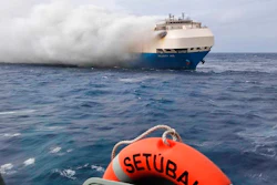 In this undated photo provided by the Portuguese Navy, smoke billows from the burning Felicity Ace car transport ship as seen from the Portuguese Navy NPR Setubal ship southeast of the mid-Atlantic Portuguese Azores Islands. The ship's crew were taken by helicopter to Faial island on the archipelago, about 170 kilometers (100 miles) away on Wednesday, Feb. 16, 2022. There were no reported injuries.