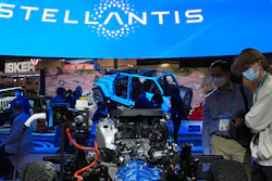 People look at the charging technology from the Jeep Wrangler 4xe at the Stellantis booth during the CES tech show Thursday, Jan. 6, 2022, in Las Vegas. Automaker Stellantis said Wednesday, Feb. 23, 2022 that it made 13.4 billion euros ($15.2 billion) in its first year after it was formed from the merger of Fiat Chrysler Automobiles and PSA Group.