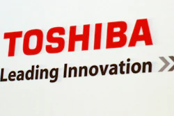 In this June 15, 2017, file photo, the logo of Toshiba Corp., Japan's electronics and energy company, is seen on a screen during a press conference in Yokosuka, near Tokyo. Embattled Japanese technology giant Toshiba on Monday, Feb. 7, 2022, announced it is splitting into two companies, one focused on infrastructure and the other on devices, to try to bring value to shareholders.