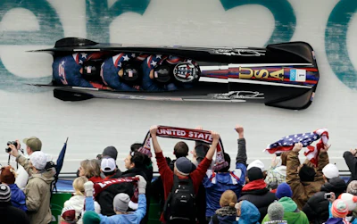 Bobsled teams must tuck themselves behind the leading edge of the sled to avoid the oncoming air.