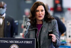 Michigan Gov. Gretchen Whitmer addresses business leaders, Monday, Dec. 20, 2021, in Detroit. Gov. Whitmer's office has announced plans for the first electric vehicle charging road in the U.S. to be built in Detroit by 2023.