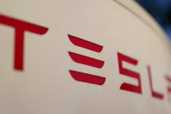 The logo for the Tesla Supercharger station is seen in Buford, GA, April 22, 2021.