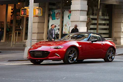 This photo provided by Mazda shows the 2022 Mazda MX-5 Miata, a small rear-wheel-drive roadster that's a rarity among cars today.