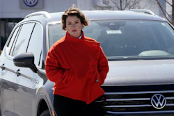 Kendall Heiman stands with a loner car in Lawrence, Kan., March 9, 2022.