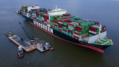 Crews dredge near the container ship Ever Forward near Pasadena, Md., March 21, 2022.