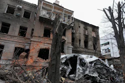 A damaged building and car after recent shelling, in the center of Kharkiv, Ukraine, Sunday, March 27, 2022.