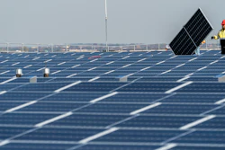 Electricians with IBEW Local 3 install solar panels on top of the Terminal B garage at LaGuardia Airport, Nov. 9, 2021, in the Queens borough of New York. The Commerce Department says it is investigating whether imports of solar panels from Southeast Asia are circumventing anti-dumping rules that block imports from China. The decision could dramatically reduce solar imports to the U.S. and undercut President Joe Biden’s ambitious climate goals. Clean energy leaders said the investigation could lead to thousands of layoffs in the domestic solar industry and imperil up to 80% of planned solar projects in the U.S.