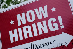 A 'now hiring' sign is posted in Garnet Valley, Pa., Monday, May 10, 2021. Job openings stayed at a near-record level in February, 2022, little changed from the previous month, continuing a trend that Federal Reserve officials see as a driver of inflation.