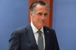 Sen. Mitt Romney, R-Utah, arrives to watch a speech by Ukrainian President Volodymyr Zelenskyy live-streamed into the U.S. Capitol, in Washington, March 16, 2022. Lawmakers seemed on the brink of clinching a bipartisan compromise Thursday, March 31, to provide a fresh $10 billion to combat COVID-19. Romney said bargainers had reach an agreement in principle on a package but said it was still being drafted. Other senators were less definitive but none contested that a deal was near.