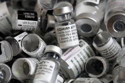 In this file photo dated Saturday, May 15, 2021, empty vials of the Pfizer-BioNTech COVID-19 vaccine lie in a box during a vaccine campaign at the Vaccine Village in Ebersberg near Munich, Germany. Germany's health ministry said Monday that the country may have to discard 3 million doses of expired COVID-19 vaccine by the end of June.