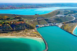 This undated photo provided by Consumers Energy shows an aerial view of the Ludington Pumped Storage Plant near Ludington, Mich. The plant generates electricity by pumping water from Lake Michigan to a reservoir on top of a bluff, then releasing it through giant turbines as needed. Advocates of pumped storage call such facilities the 'world's largest batteries.'
