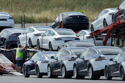 In this May 13, 2020, file photo, Tesla cars are loaded onto carriers at the Tesla electric car plant in Fremont, Calif. California wants electric vehicle sales to triple in the next four years to 35% of all new car purchases. Regulations passed Tuesday, April 12, 2022 by the California Air Resources Board set a roadmap for the state to achieve California Gov. Gavin Newsom's ambitious goal of phasing out the sale of new gas powered cars. The draft must go through a months-long state regulatory process and get approval from the U.S. EPA.