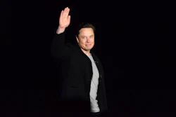 Elon Musk waves while providing an update on SpaceX's Starship, Thursday, Feb. 10, 2022, near Brownsville, Texas. In April 2022, a group of Tesla shareholders suing Musk over some 2018 tweets about taking the company private is asking a federal judge to order him to stop commenting on the case.