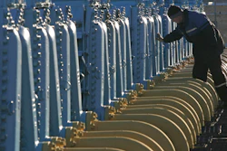 A Belarusian worker on duty at a gas compressor station of the Yamal-Europe pipeline near Nesvizh, some 130 km (81 miles) southwest of the capital Minsk, Belarus, Dec. 29, 2006. Officials in Poland and Bulgaria say Russia is suspending their countries’ natural gas deliveries starting on Wednesday. The governments of the two European countries said Tuesday April 26, 2022, that Russian energy giant Gazprom informed them it was halting gas supplies.