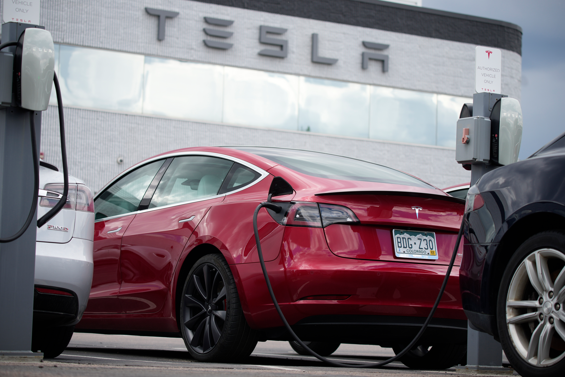 A 2021 Tesla Model 3 sedan sits in a near-empty lot at a Tesla dealership in Littleton, Colo. June 27, 2021. Tesla has recalled 14,684 Model 3s due to a software glitch that could cause collisions, its second recall this month, China's market regulator said Friday, April 29, 2022.