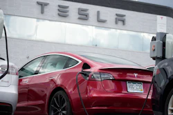 A 2021 Tesla Model 3 sedan sits in a near-empty lot at a Tesla dealership in Littleton, Colo. June 27, 2021. Tesla has recalled 14,684 Model 3s due to a software glitch that could cause collisions, its second recall this month, China's market regulator said Friday, April 29, 2022.