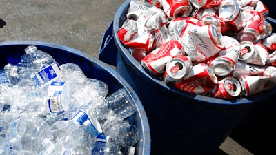 Cans and plastic bottles brought in for recycling fill containers at a recycling center in Sacramento, Calif., July 5, 2016. Gov. Gavin Newsom's administration proposed Friday, April 1, 2022, to temporarily double California's typical nickel refunds for bottles and cans to boost recycling and help spend down a roughly $600 million surplus built up during the coronavirus pandemic.