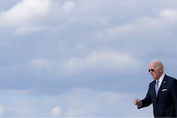 President Joe Biden walks to a motorcade vehicle after stepping off Air Force One, Tuesday, April 19, 2022, at Andrews Air Force Base, Md. Biden is returning to Washington after promoting his infrastructure agenda in New Hampshire.