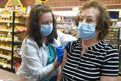 Pharmacist Karen Flynn gives a second Moderna booster shot to her mother Joann Pangonis, of New Boston, Pa., at Morris Drug in Mahanoy City, Pa., on Friday, April 1, 2022. An extra-contagious version of the omicron coronavirus variant has taken over the world. The variant scientists call BA.2 is now dominant in at least 68 countries, including the U.S. The World Health Organization says it makes up about 94% of sequenced omicron cases submitted in the most recent week to an international database.