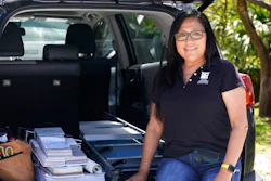 Natalia Ponce De Leon, owner of Custom Window Furnishings, sits on the back of her nine-year-old Toyota RAV4 after visiting with a client, Wednesday, April 13, 2022, in Delray Beach, Fla. Ponce De Leon traded her 2018 Toyota Tacoma for a more efficient car where she estimates will save her hundreds of dollars a month. She is also able to carry all the tools she needs for her business.