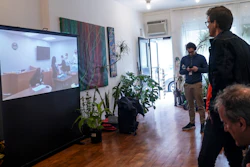 Amazon Labor Union lead organizer Mat Cusick, second from right, standing, watches a zoom-cast of vote counting to unionize an Amazon warehouse in Staten Island, N.Y., March 31, 2022.