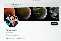 Part of the Twitter page of Elon Musk is seen on the screen of a computer in Sausalito, Calif., on Monday, April 25, 2022. The Tesla CEO gave the strongest hint yet Monday, May 16, 2022, that he would like to pay less for Twitter than his $44 billion offer made the previous month.