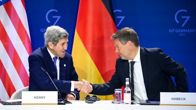 German Economy and Climate Minister Robert Habeck, right, and John Kerry, left, Special Envoy of the U.S. President for Climate, shake hands after they signed a declaration of intent to establish a German-American climate and energy partnership between the United States of America and Germany at the meeting of the G7 Ministers for Climate, Energy and Environment in Berlin, Germany, Monday, May. 27, 2022.