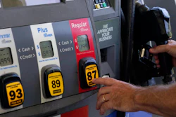 A customer pumps gas at an Exxon gas station, May 10, 2022, Miami.