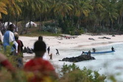 Rescuers gather at Galawa Beach, 35 kilometers from Moroni, Comoros, July 1, 2009, as they prepare to search the area after a Yemenia Airbus passenger plane crashed into the Indian Ocean off the island nation of Comoros, early Tuesday, as it attempted to land in the dark amid howling winds. The lone survivor of a 2009 plane crash that killed 152 other people is expected to attend the trial of Yemen's main airline which is opening Monday May 9, 2022 in Paris.