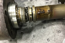 Leak from a gear pump that was pumping petroleum-based oil. The seal has Buna-N elastomers on it, which are swollen and wrinkled, and had pulled away from the rotary part of the seal—thus causing the leak.